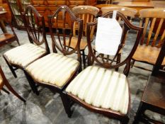 Set of three Hepplewhite-style mahogany shield-back dining chairs with serpentine fronted seats and