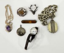 Victorian silver coloured locket and chain, the oval locket with wirework decoration,