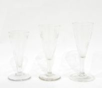 Georgian ale glass the base of the bowl with slab cut decoration and with engraved festoons,