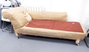 Victorian chaise longue with cream and gold diamond fabric, on turned supports and castors,