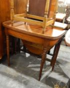 George III mahogany foldover tea table on turned supports and an oak rectangular occasional table