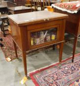 Early 20th century mahogany drinks cabinet, the top opening to reveal glass holders and glasses,