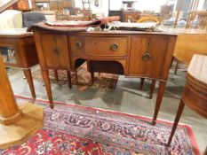 Serpentine fronted sideboard with single frieze drawer and two flanking cupboards with cockbead