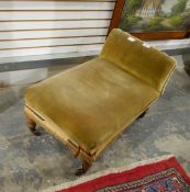 An adjustable gout stool with upholstered top and back on turned legs with castors