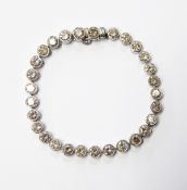 Platinum and diamond tennis bracelet set 29 round brilliant cut collet-set diamonds, the diamonds 9.