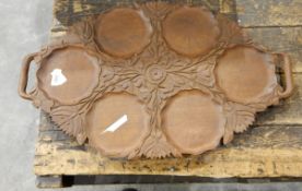 A papier mache tray in need of repair and a carved wooden tray/platter ( 2)