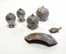 Eastern silver-coloured metal buckle, four Eastern silver-coloured metal condiments,