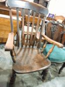 A 19th century lathback elm-seated carver chair