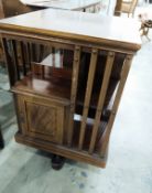 Edwardian mahogany revolving bookcase with satinwood and ebony stringing,