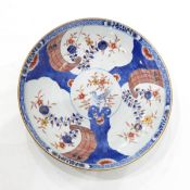 18th century Chinese export bowl decorated with sprigs of flower in pink, orange and green,