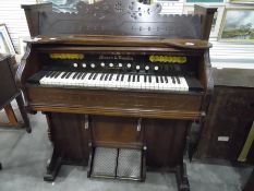 A Mason & Hamlin stained walnut harmonium Victorian marquetry inlaid figured cabinet with boxwood