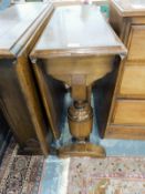 Two oak drop-leaf dining tables together with a nest of three tables and a small Sutherland table