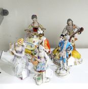 Pair of continental porcelain figures, one depicting a gentleman playing a cello,