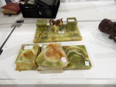 Onyx desk inkstand of rectangular form with two square inkwells and surmounted by a cold painted