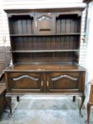 19th century oak sideboard with open plate display racks, cupboard underneath,