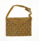 Early 20th century bead purse of rectangular form, geometric design in silver and red beads,