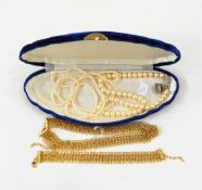 Assorted costume jewellery to include necklaces, brooches, faux-pearls, empty boxes,