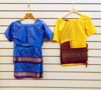 Thirteen Indian saris and sari blouses and lilac embroidered Indian tunic and trousers