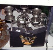 Large metal candelabrum, a wicker and metal side table, a brass-coloured candelabrum,