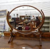 Georgian style mahogany oval framed dressing table mirror on splayed supports,