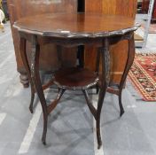 Walnut side table with wavy edge top, on cabriole supports with under-shelf,