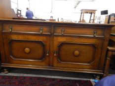 Oak side cupboard with two frieze drawers, pair panel doors below enclosing shelf, on turned feet,