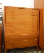 20th century teak bedroom suite by Maple viz:- a mirror-back dressing table with an arrangement of