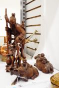 Oriental hardwood carved Japanese figure in traditional dress together with two hardwood carved