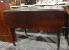 19th century mahogany pembroke table with frieze drawer, on ring turned tapering legs,