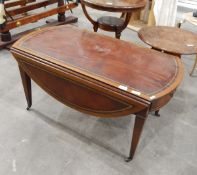 Fall-flap coffee table with tooled leather inset top