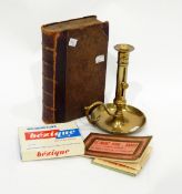 Various collectables including brass chamberstick, old games, postcards,