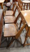 Oak triple seat with three hinged seat boards, on trestle supports,