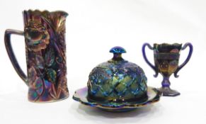 Black carnival glass bowl of circular form, decorated with a kangaroo in trees,