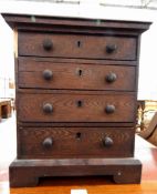 19th century oak miniature chest of drawers with moulded edge top,