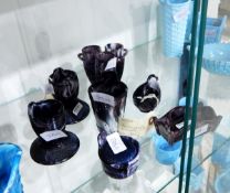 Collection of Victorian purple marbled pressed glass items including a vase modelled as three