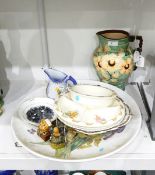 Large pottery charger with handpainted floral spray, 42cm diameter,