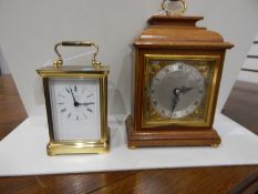 Carriage clock in lacquered brass case, the dial with Roman numerals and inscribed 