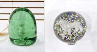 19th century green glass dump paperweight, with a central sulphide figure of a boy 9cm high,