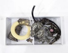 Silver child's rattle, in the form of a cat and suspended from a plastic ring,