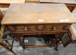 Oak side table, fitted with a frieze drawer, and a fall-flap table, with tooled leather insert top,