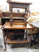 Jacobean-style oak stool on turned supports together with a two-tier oak tea trolley on spiral