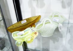 Victorian vaseline pressed glass model of a pram, 6cm high with concentric circle mark to base,