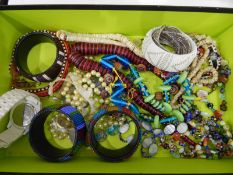 A quantity of costume jewellery, including bead bangles, Murano glass necklaces etc.