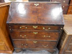 Georgian oak bureau, the fall-front enclosing a fitted interior of small drawers and pigeonholes,