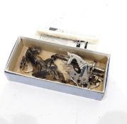 Vintage cased sewing machine with accessories and small booklet of instruction