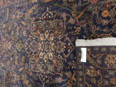 Handmade Afghan wool Belouch rug with deep blue ground, of floral and tree design,