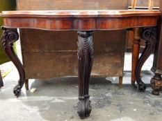 Victorian mahogany foldover card table with moulded wavy edge, plain frieze,