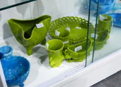 Collection of Victorian Sowerby opaque vivid green pressed glass comprising three vases with swan