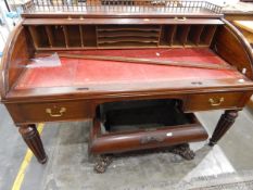 Early Victorian mahogany roll-top desk having a turned spindle three-quarter gallery,