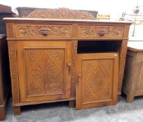 Victorian oak side cupboard with foliate carved back,